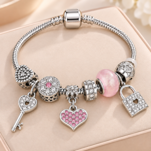 PULSEIRA DE CHARMS - CHAVE DO CORAÇÃO ROSA